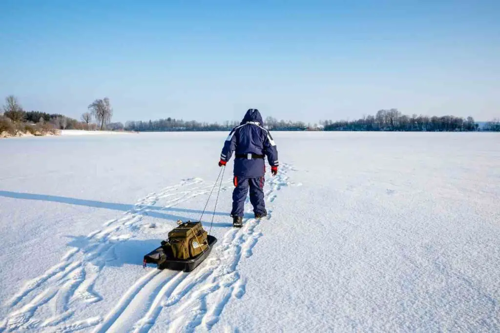 Ice fishing sleds on lake